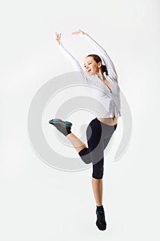 Weight loss fitness woman jumping of joy. Caucasian female model