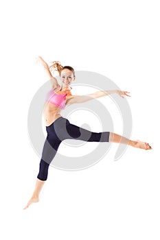 Weight loss fitness woman jumping of joy. Young sporty Caucasian female model isolated in full body