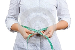 Weight Loss and Healthy Lifestyle Concept. Fitness Woman Measuring Her Waistline with Measure Tape