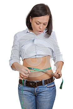 Weight Loss and Healthy Lifestyle Concept. Fitness Woman Measuring Her Waistline with Measure Tape