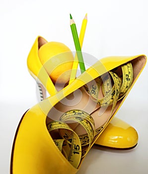 Weight Loss .Measuring tape wrapped around lemons