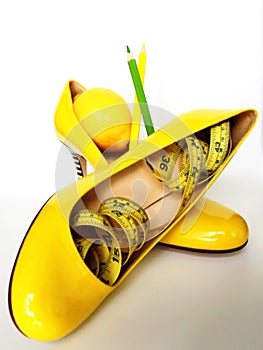 Weight Loss .Measuring tape wrapped around lemons