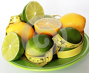 Weight Loss .Measuring tape wrapped around lemons