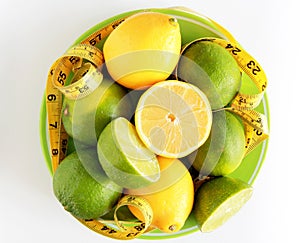 Weight Loss .Measuring tape wrapped around lemons