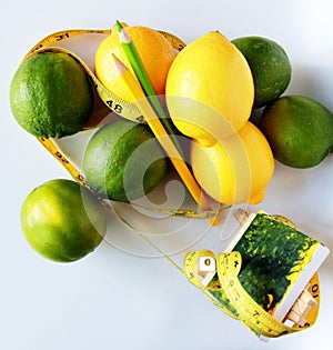 Weight Loss .Measuring tape wrapped around lemons