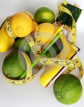 Weight Loss .Measuring tape wrapped around lemons