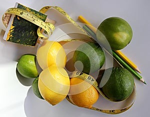 Weight Loss .Measuring tape wrapped around lemons