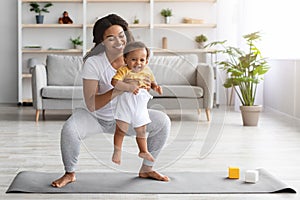 Weight Loss After Pregnancy. Black Mom Training At Home With Infant Baby