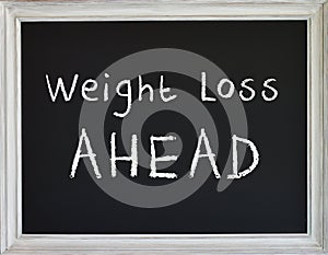 Weight Loss Sign on Black Chalk Board