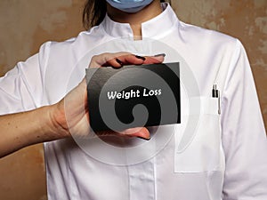 Weight Loss sign on the piece of paper