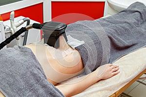 Weight loss and slimming cryolipolysis treatment in beauty salon