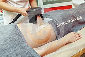 Weight loss and slimming cryolipolysis treatment in beauty salon