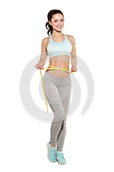 Weight loss, sports girl measuring her waist