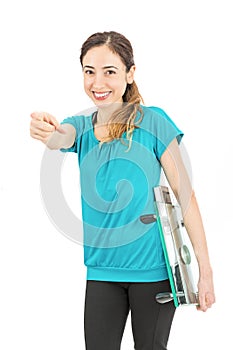 Weight loss woman smiling and pointing at the camera