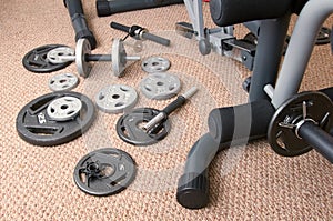 Weight Plates beside exercise machine