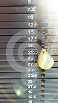 Weight stack scale with graduation in kilograms with pin and sunbeam photo