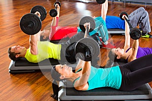 Weight training in the gym with dumbbells
