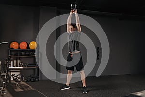 Weightlifter doing swings with kettlebell