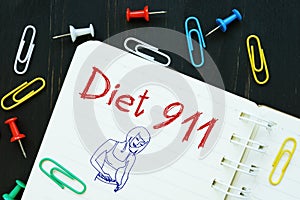 Weightloss concept meaning diet 911 with phrase on the piece of paper