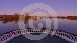 Weir of lake during sunset