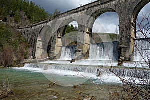 A weir in a river. a non-urban scene day