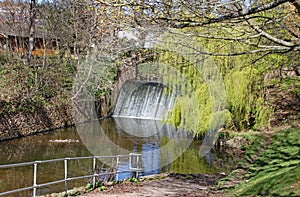 The weir on the river Sid in Sidmouth, Devon in the parkland area known as The Byes