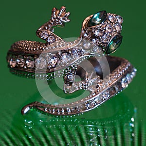 Weird Lizard Ring with lots of gems and stones.