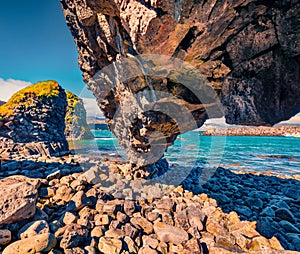 Weird shapes of basalt columns on the shore of small fishing village - Arnarstapi or Stapi. photo