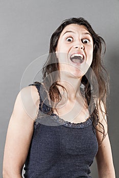 Weird young woman expressing amazement or surprise