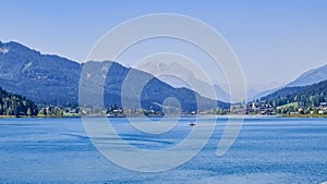 Weissensee - Scenic view of east bank of alpine lake Weissensee in Gailtal Alps, Carinthia, Austria photo