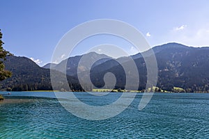 Weissensee - Scenic view of east bank of alpine lake Weissensee in Gailtal Alps, Carinthia, Austria photo