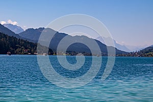 Weissensee - Scenic view of east bank of alpine lake Weissensee in Gailtal Alps, Carinthia, Austria photo