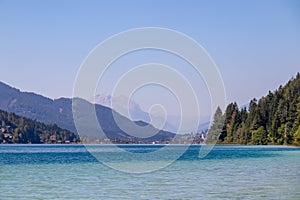 Weissensee - Scenic view of east bank of alpine lake Weissensee in Gailtal Alps, Carinthia, Austria photo