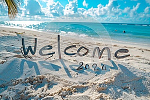 Welcome 2024 text written on the sandy beach.