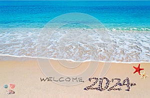 Welcome 2024 written on the sand