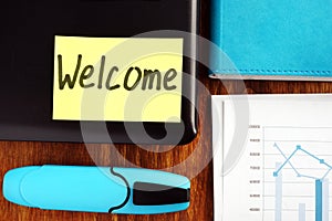 Welcome aboard concept. Laptop and papers.