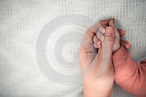 Welcome baby,Mother holding her newborn baby by little hand