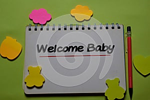 Welcome Baby write on a book isolated on office desk