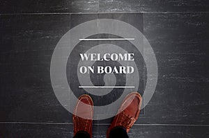 Welcome on board sign on floor