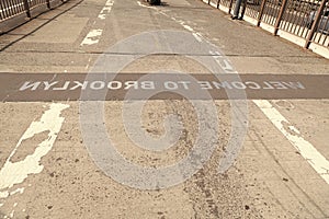 welcome brooklyn sign of brooklyn bridgeroad way to manhattan, new york