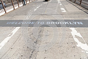 welcome brooklyn sign of brooklyn bridgeroad way to manhattan, new york