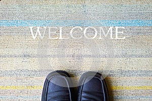 Welcome carpet with leather shoes