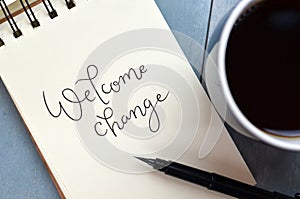 WELCOME CHANGE hand-lettered in notepad