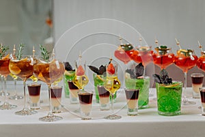 Welcome drink with cocktail glasses and drinks at an event. Alcoholic beverages at a wedding