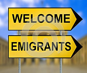 Welcome and Emigrants traffic sign with blurred Berlin background photo