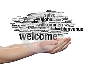 Welcome or greeting international word cloud in hand, different languages or multilingual