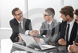 Welcome handshake business partners at a meeting in the office