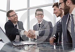 Welcome handshake business partners in the office