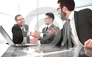 welcome handshake business partners in the office