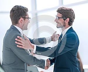 Welcome handshake business partners in the office